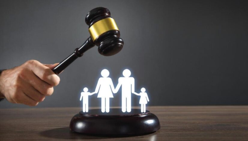 male-hand-holding-judge-gavel-with-family-symbol_family_law